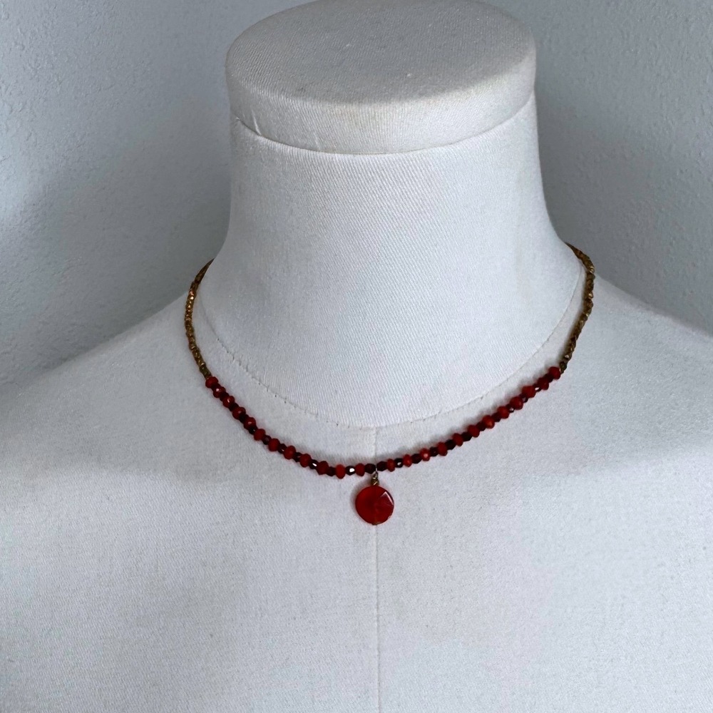 Red and gold beaded choker with drop charm pendant